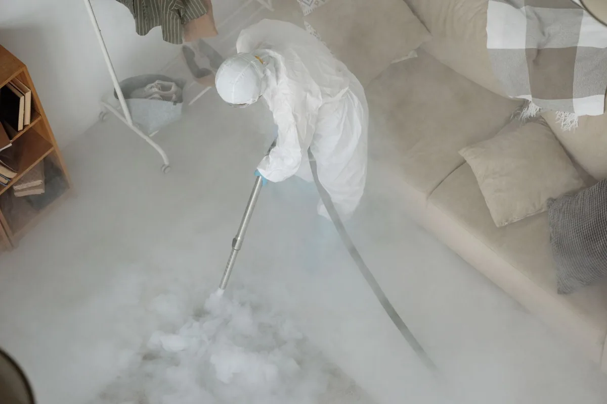 Biohazard cleanup technician in protective equipment, Smithfield, UT